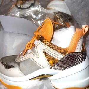 BRAND NEW, NEVER BEEN WORN! Stunning MK Olympia trainer, size 8.5M.